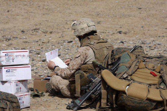 Soldier Reading United for the Troops Letter